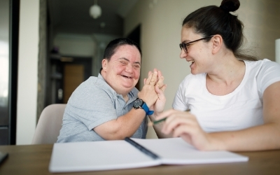 Two people clasping hands