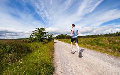 A man jogging in the countryside