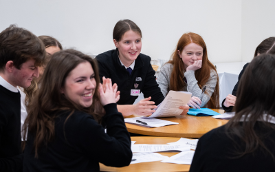 High school pupils sitting together working on a project